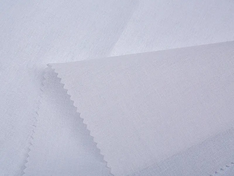 Mengapa T/C Woven Fusible Shirt Interlining secara signifikan meningkatkan kenyamanan kemeja?